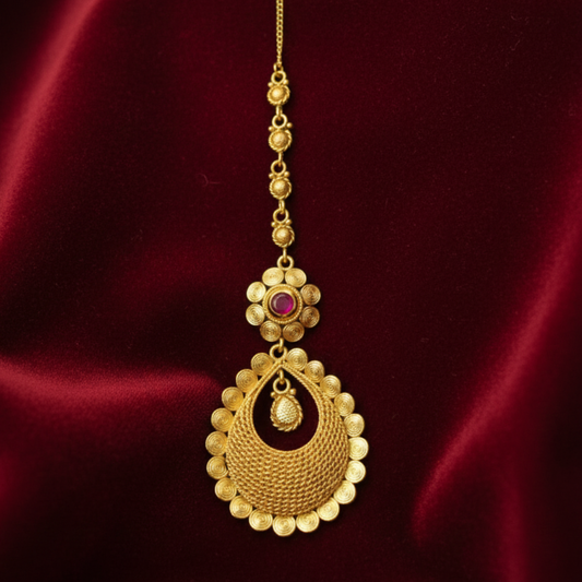 Gold plated maang tikka with oval flower red stone